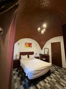 a bedroom with a large bed in a room at KR Hotel in Luxor +94 photos