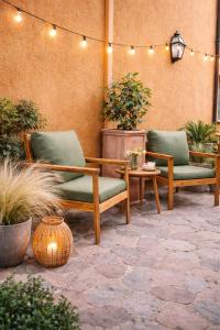 two chairs and a table on a patio at ClaMar Apart Hotel in Porto Ercole