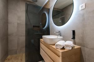 a bathroom with a sink and a mirror at Bottega in Mlini +16 photos