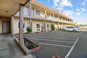 a parking lot in front of a building at Crystal Motel in Red Bluff