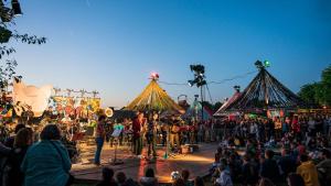 a crowd of people at a fair with tents at Gîte de La Petite Mauve in Baule +79 photos