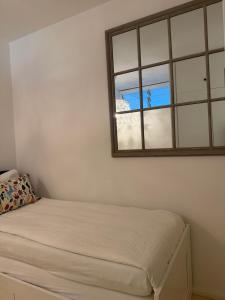 a bedroom with a bed and a window at QuietApartment in Bellinzona