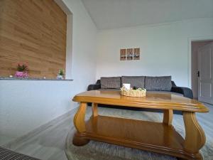 a living room with a table and a couch at Lone Star Apartments in Gusinje