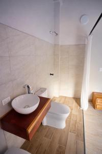 a bathroom with a sink and a toilet at Casa Manglares Capurganá in Acanti