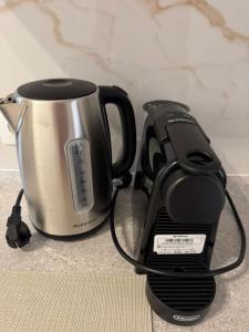 a coffee maker and a toaster sitting on a counter at Alexander in Ierissos