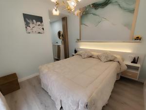 a bedroom with a large bed in a room at Albatros centro Lucena in Lucena