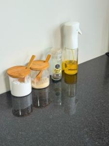 a counter top with two bottles of oil and a blender at Pousada Barcelos Florianópolis in Florianópolis