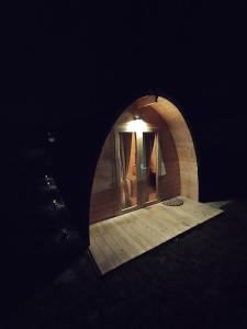 a dark room with a mirror in a tunnel at Au petit chalet in Meisenthal