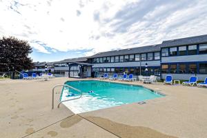 a large swimming pool in front of a building at Unit 117 for Poolside Fun in Wells