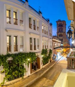 a city street at night with a building at Cinco Quintas Hotel Boutique in Cartagena de Indias
