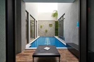 a swimming pool in the middle of a house at The Castle Ballet Taichung A Boutique Hotel in Taichung