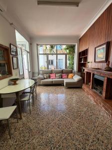 a living room with a couch and a fireplace at Ca'n Claret in Llucmajor