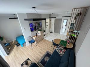 an overhead view of a living room with a blue couch at Apartament Calisia II in Kalisz +5 photos
