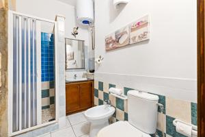a bathroom with a toilet and a sink at Bed and Breakfast Cala Luna in Castelsardo +31 photos