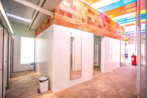 a room with a wall with a rainbow wall at Camping Clarà in Torredembarra +128 photos