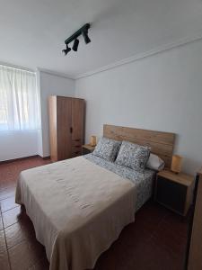 a bedroom with a large bed in a room at Casa Salamó in Ampuero