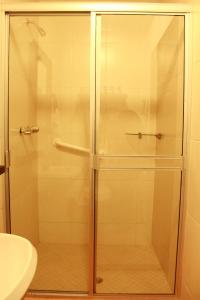 a shower with a glass door in a bathroom at Cielito Lindo in Los Algodones