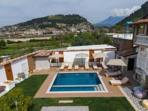 a villa with a swimming pool and a view at Villa Lejzo - Swimming Pool in Berat