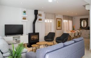 a living room with a couch and a fireplace at Villa Paula Trinidad in Salou