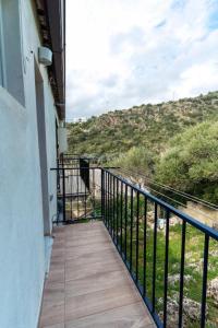 a balcony with a view of a hill at B&B Morrocoy Beach in Marina di Camerota