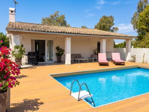 a villa with a swimming pool and a house at Villa Sunlight Sidari with private pool by DadoVillas in Sidari