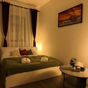 a bedroom with a bed with two skulls on it at Nefrit Garni & Bar in Česká Kamenice +18 photos