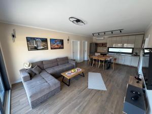 a living room with a couch and a table at Villa Vento Mostar in Mostar