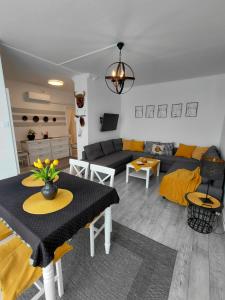 a living room with a couch and a table at Duna Kuckó in Mohács