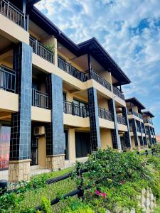 a large apartment building with balconies and flowers at 15 Surabaya in Margate