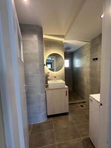 a bathroom with a sink and a mirror at Pine and Sea in Artemida +41 photos