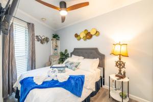 a bedroom with a bed and a ceiling fan at Casa Del Mar 231 - Ocean View Family Retreat on Seawall in Galveston +43 photos