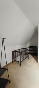 a room with two beds and a tripod next to a wall at Isabella in Weißwasser
