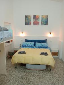 a bedroom with a bed with two towels on it at Casa vacanze l'ulivo in Maracalagonis