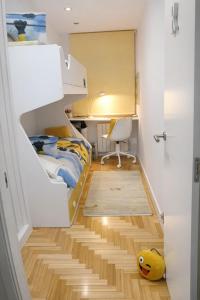 a small room with a bed and a desk at La Bahía in Baiona +7 photos