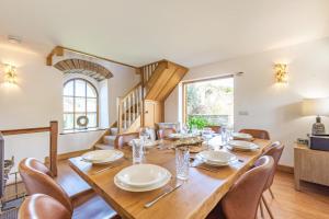 a dining room with a wooden table and chairs at 3 Bed in Croyde oc-s27761 in Croyde