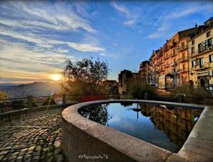 a pool of water in the middle of a city at Casa Zia Maria in Pollina