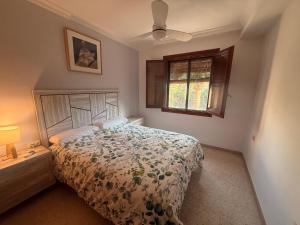 a bedroom with a bed and a window at Charming Home in Lorca Murcia in Lorca