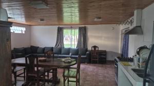 a living room with a couch and a table at Complejo Casablanca Plottier in Plottier
