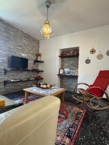 a living room with a couch and a table at Il Vecchio Torchio in Perledo