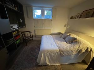 a bedroom with a bed and a window at 64 Cressingham Road in London