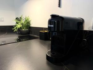 a coffee maker sitting on top of a counter at Jacuzzi privatif Appartement premium Vendôme in Vendôme