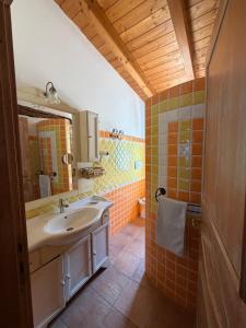 a bathroom with a sink and a mirror at Villa Veronica in Sedini +68 photos