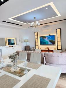 a living room with a couch and a table at Eleni Guest House in Sarandë