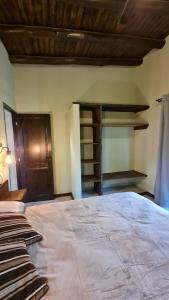 a bedroom with a large bed in a room at Cabañas Altos de San Blas 3 in Pueblito