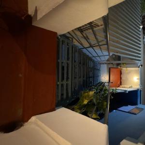 a view of a room with a bed in it at OceanBliss_Homestay04 in Villupuram