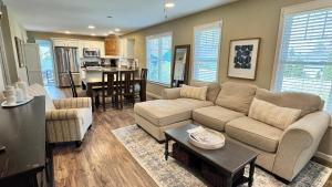 a living room with a couch and a table at The Sands in New Buffalo