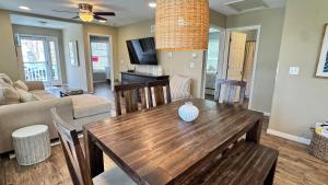 a living room with a wooden table and a couch at The Sands in New Buffalo