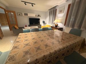 a living room with a dining table and a living room at Charming Home in Lorca Murcia in Lorca