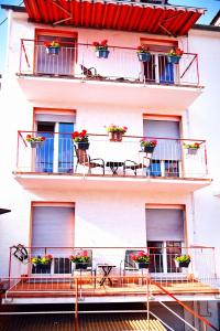 a building with flowerpots on the balconies at Holiday Rhein 4 in Boppard