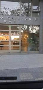 a store front of a building with a sign on it at Laurel de oro in Chillán